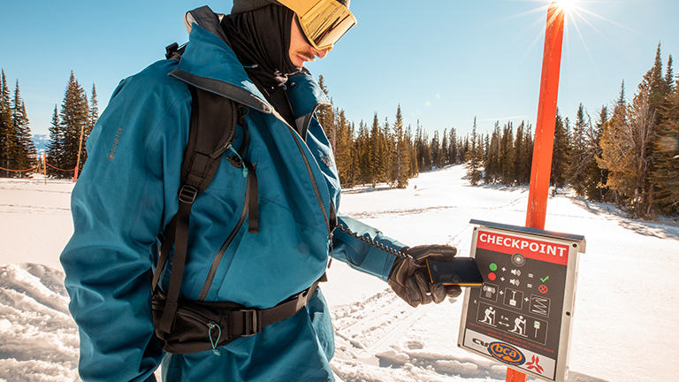 close up of scanning transmitter at an avy checkpoint in the backcountry
