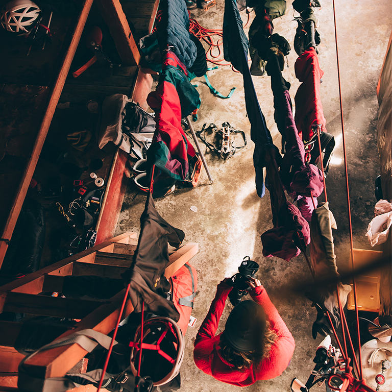 Aerial view of an ice climber and all of their gear drying in a hut