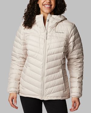 A woman wearing a white insulated jacket