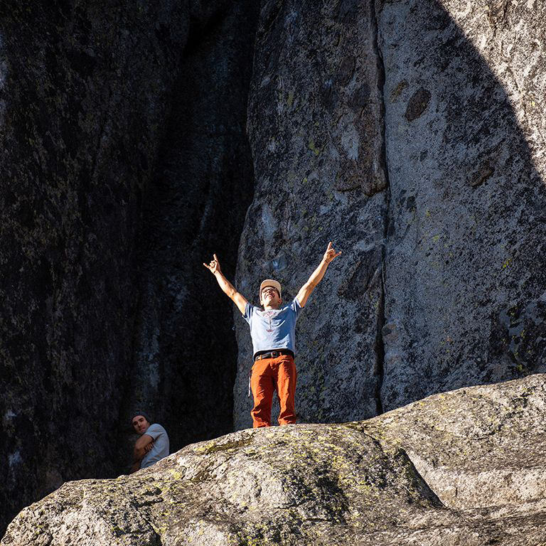 Climber doing the horns signal with his hands stoked to be at donner.