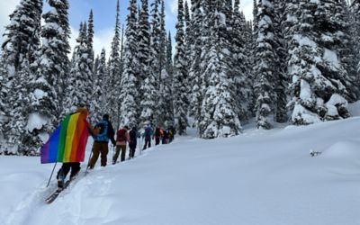 Open Mountains friends skin their way through the backcountry on skis. 
