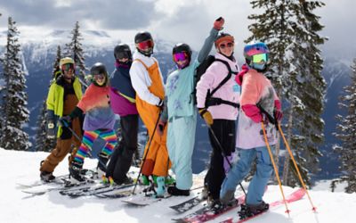 Skiers from 'People Like Us' smile for the camera.