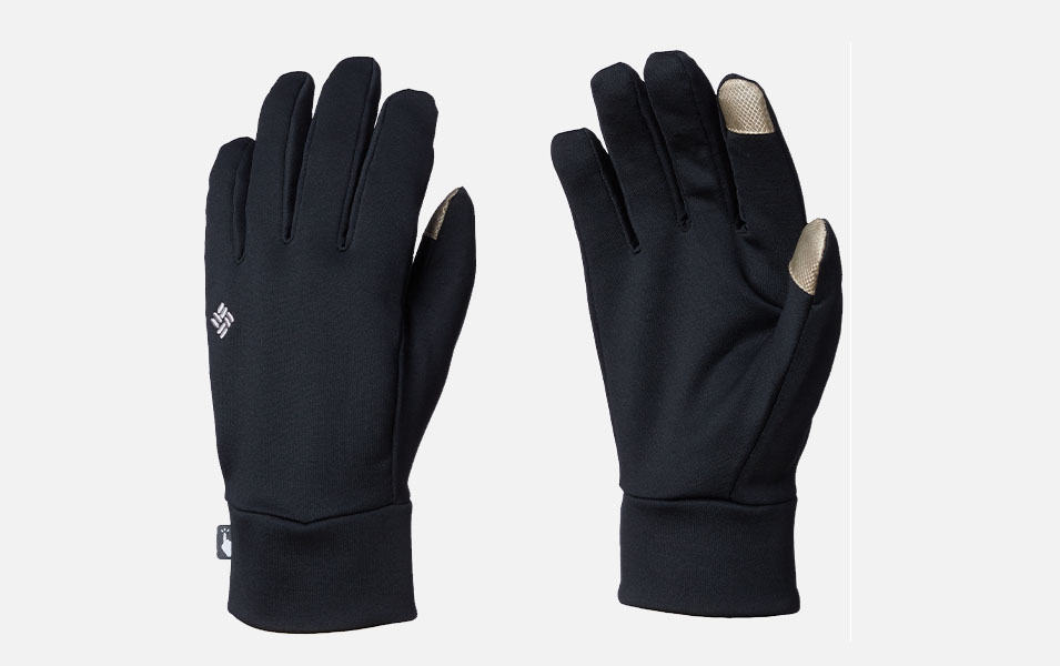 A product shot of a black pair of Columbia Sportwear liner gloves with a white background. 