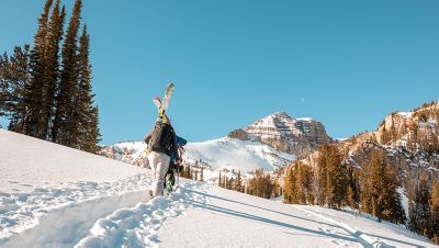 Skinning up in the backcountry on a bluebird day
