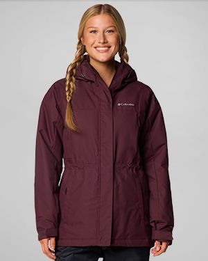 A woman wearing a dark purple jacket.
