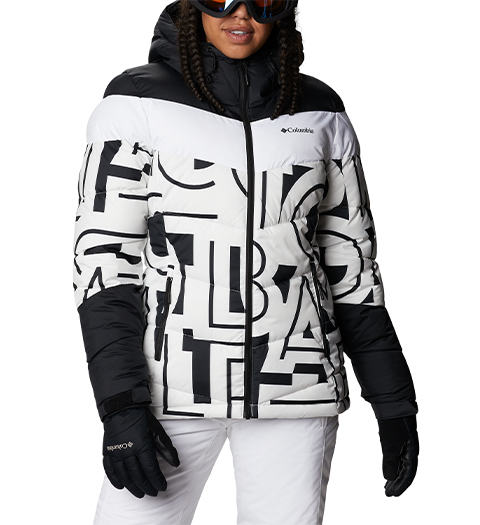 Woman wearing a ski jacket and gloves.