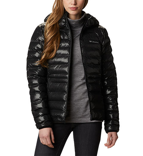Woman wearing an Omni heat Black Dot puffy jacket.