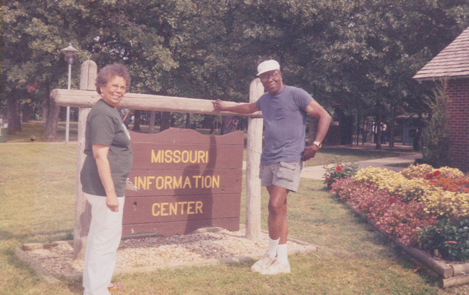 Benjamin and Frances Graham are pictured in a snapshot standing in front of a sign that reads “Missouri Information Center.”