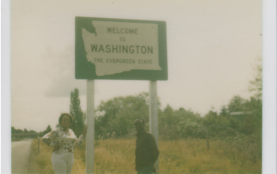 Benjamin and Frances Graham are pictured in a snapshot standing in front of a sign that reads “Missouri Information Center.”