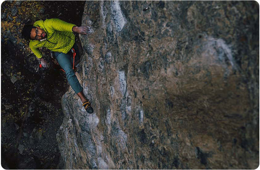 MHW athlete Caleb, looks for his next hold while lead climbing