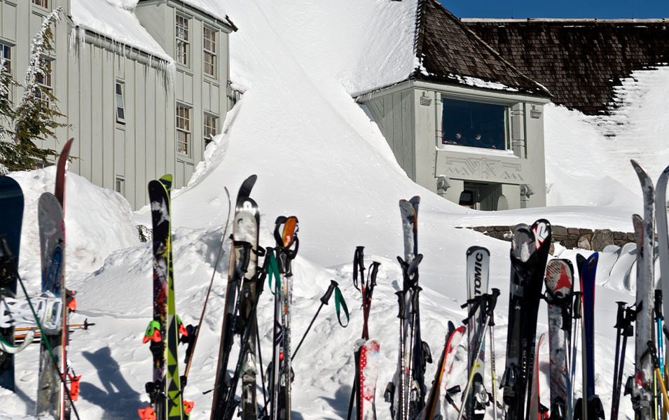  A line of skis sit in the sun on a rack outside Timberline Lodge. 