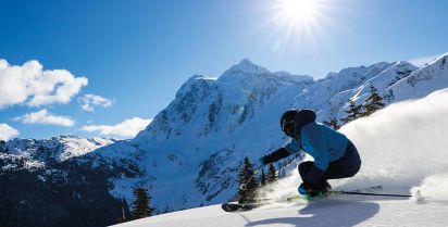 Ski skiing and snowboarding Lone young male snowboarder in black