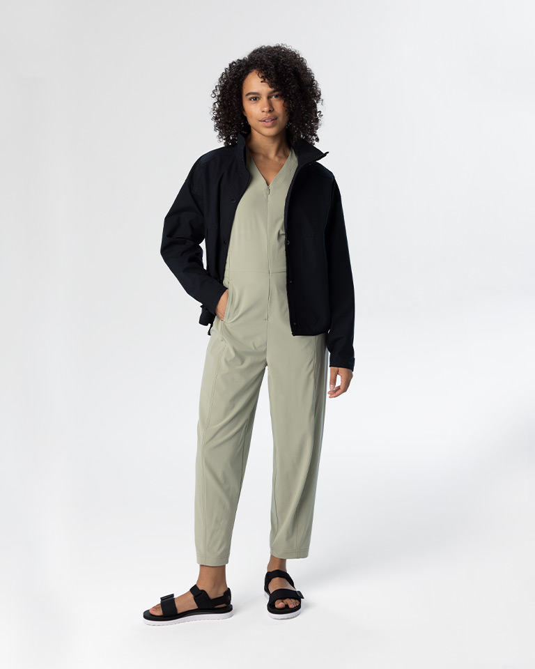 Outfit 1, a light green jumpsuit with a black cotton jacket and sandals.