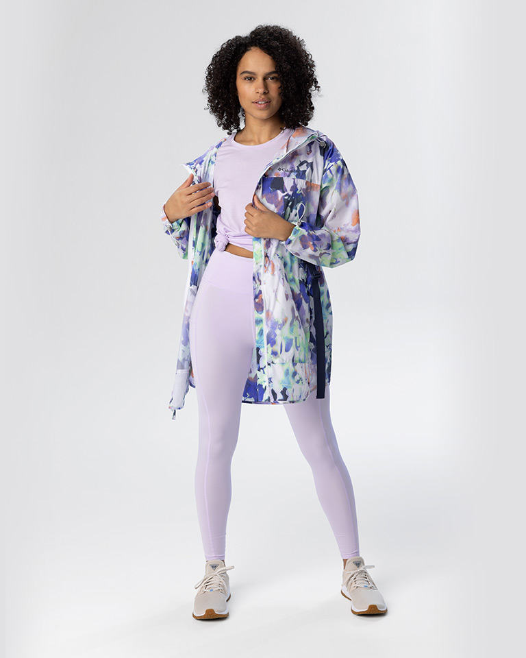 Outfit 3, a floral inspired lightweight UPF 50 protection with a matching tank and leggings with tan sneakers.