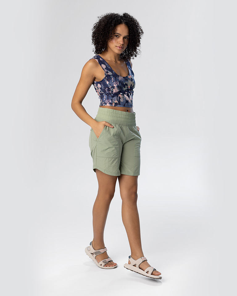 Outfit 5, a light green, lightweight short sleeve pullover with matching shorts and a cropped floral print tank top.