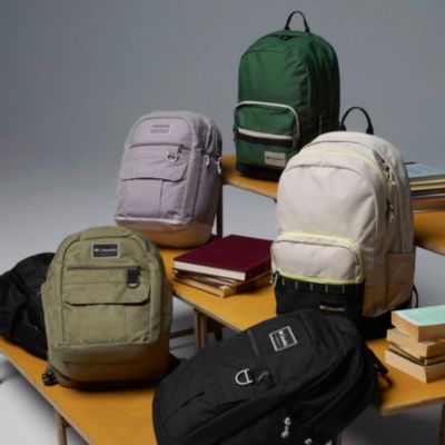 Backpacks on the bleachers.