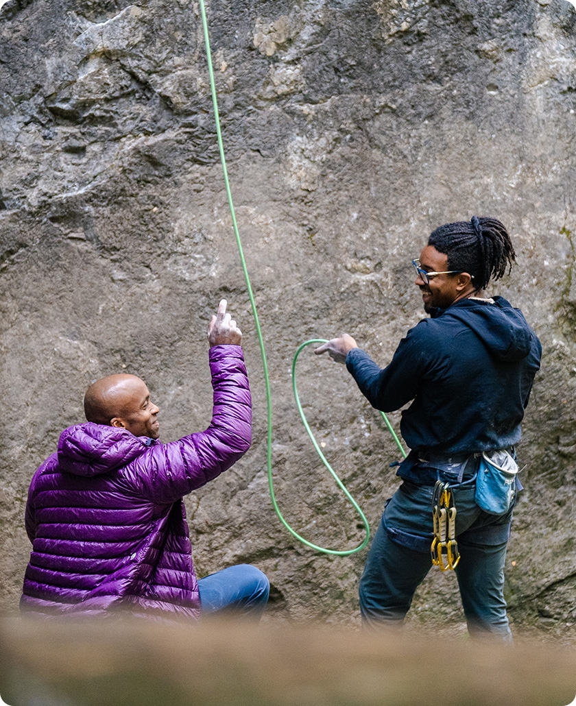 Ayo and Caleb belaying and chatting during the Open Aperture clinic