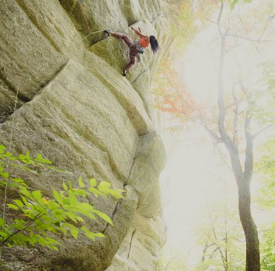 A climber scaling a rock wall.