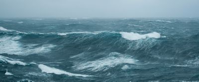 A stock photo of a stormy sea with waves crashing. 