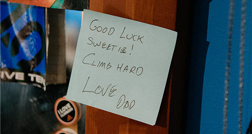 Post-it note in Kyra's bedroom that reads "Good luck sweetie! Climb hard. Love, Dad"