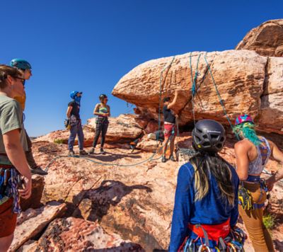 In a climbing clinic by American Alpine Club, they show the participants all the ins and outs of clipping in and creating an anchor at the top of a route.