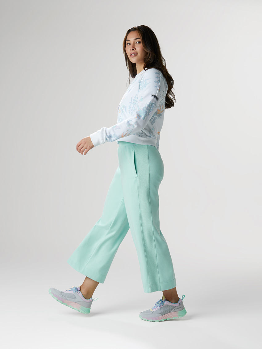 Fresh Air outfit: lightweight sky blue gaucho pants, pastel rainbow sneakers, and a floral print cropped hoodie.