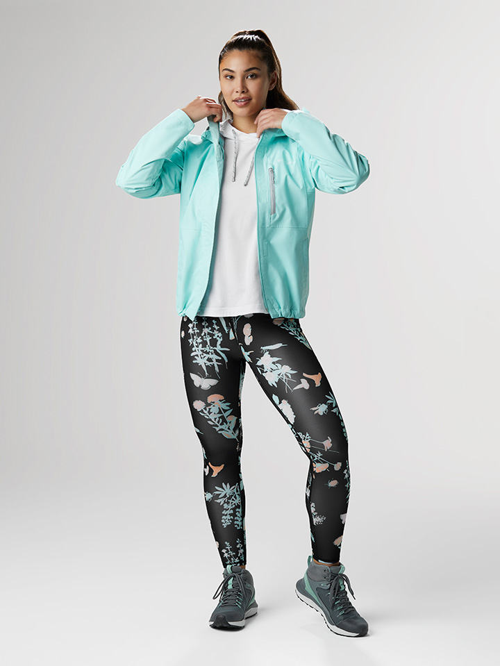 Floral Notes outfit: white hooded long sleeve shirt with black and pink floral print leggings with sneakers.