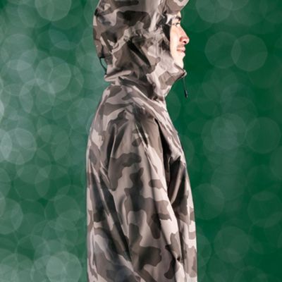 Studio shot of the Men's Stretch Ozonic in camo with a green, raindrop background
