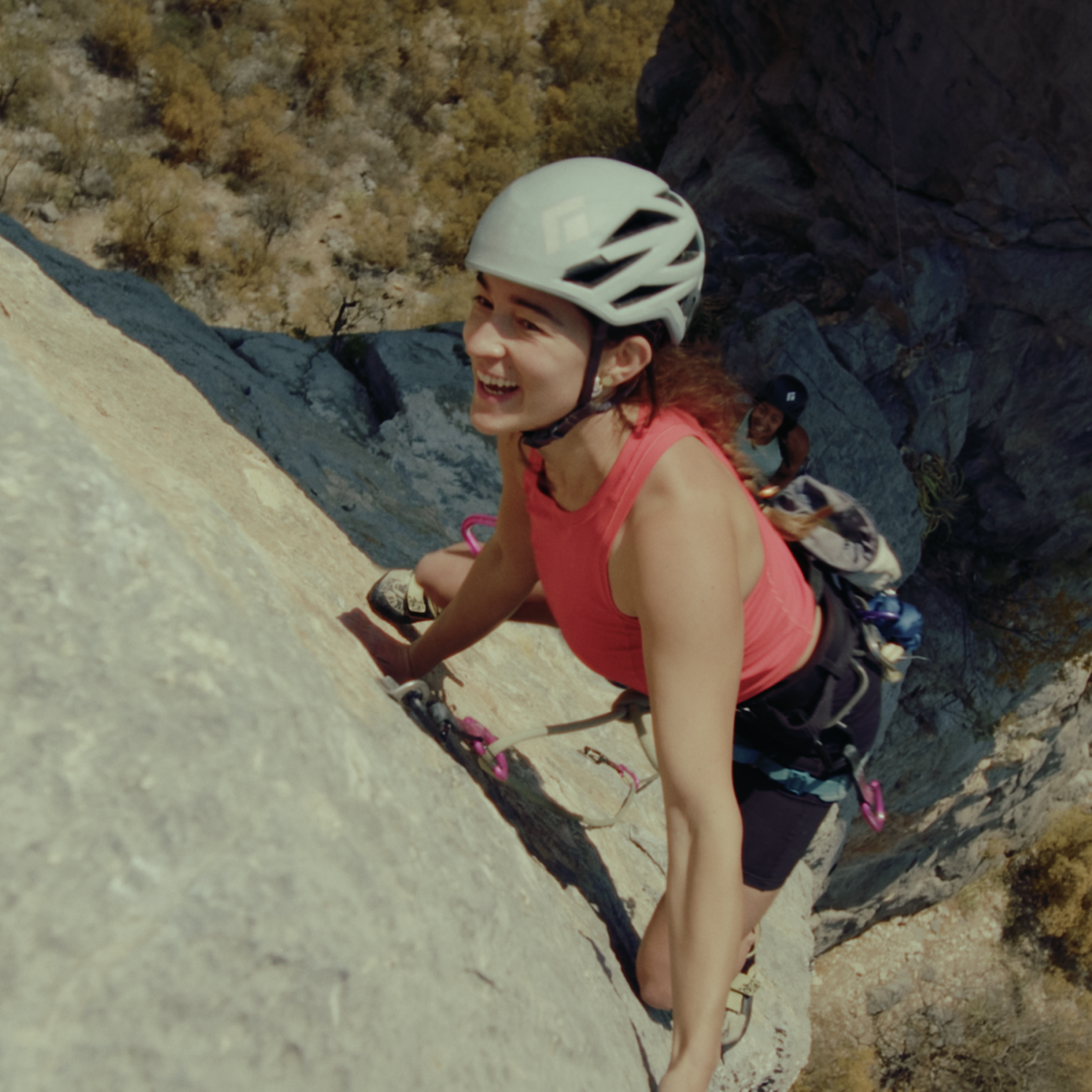 Lizzy Vanpatten all smiles while climbing in El Potrero Chico.