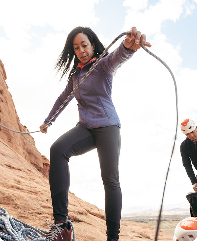 Genevive Walker coiling a rope in the desert