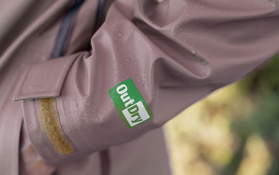 The logo of Columbia Sportswear’s OutDry™ Extreme technology is pictured on the sleeve of a rain jacket. 