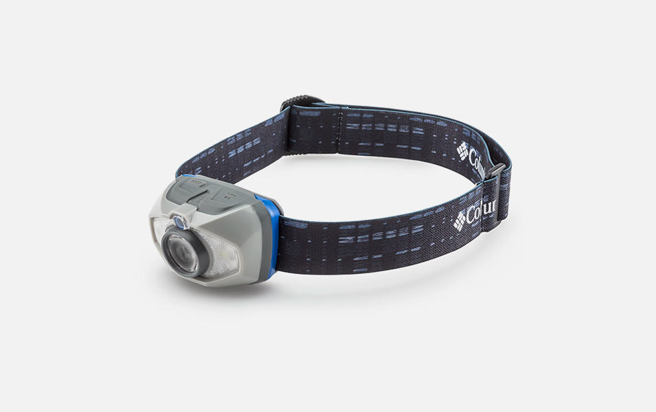A product image of a blue-and-gray Columbia Sportswear 225-lumens headlamp with a black band set against a white background.
