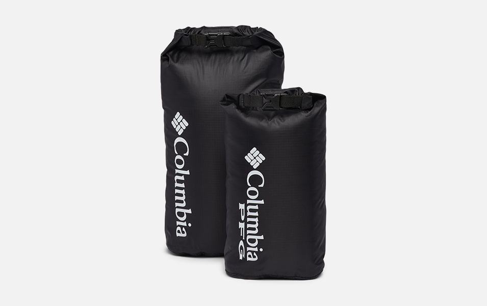 A product image of Columbia Sportswear’s two-piece Tandem Trail 6L and 3L Lightweight Dry Sack Set with a white background. Both bags are black