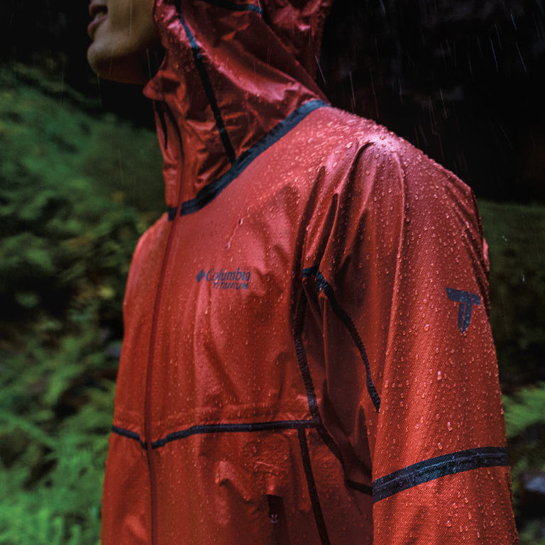 Close up of a man in a red OutDry Extreme jacket.