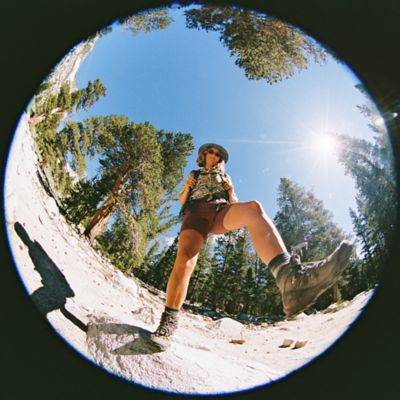 Wide lense of a hiker on a bright sunny day.