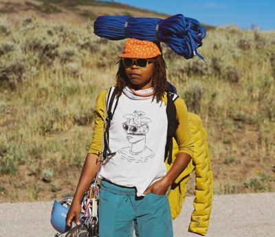 Portrait of climber looking right at camera with rope on her head