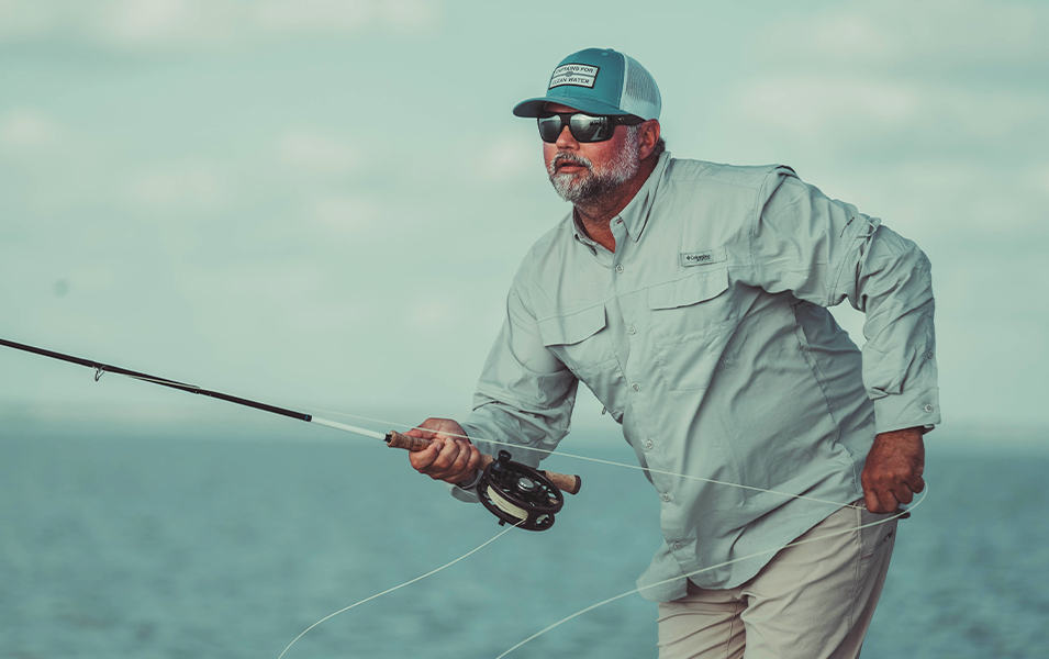 Captains for Clean Water co-founder Chris Wittmann casts a rod into the ocean in the Florida Everglades. 