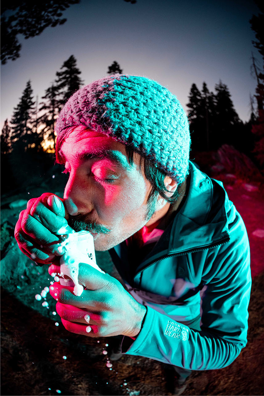 Infrared image of  popping a beer open at camp after a long day of climbing.