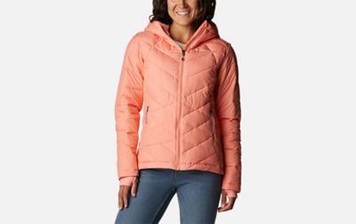 A product shot of a woman wearing a pink Columbia Sportswear Heavenly hooded jacket with a gray background.