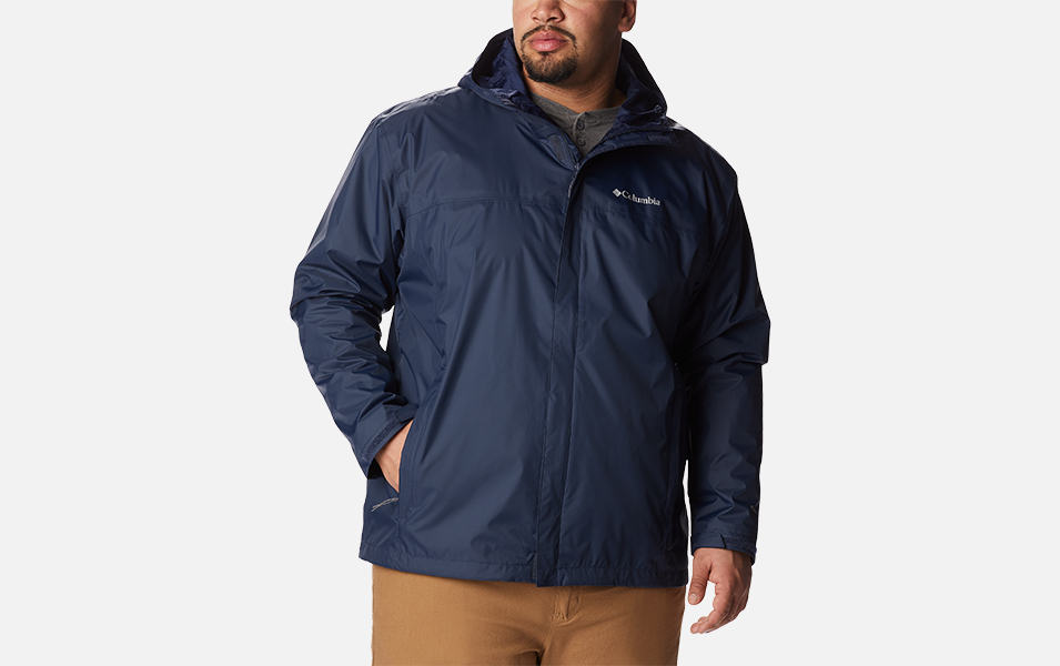 A product shot of a man wearing blue Columbia Sportswear Watertight II rain jacket with a gray background.
