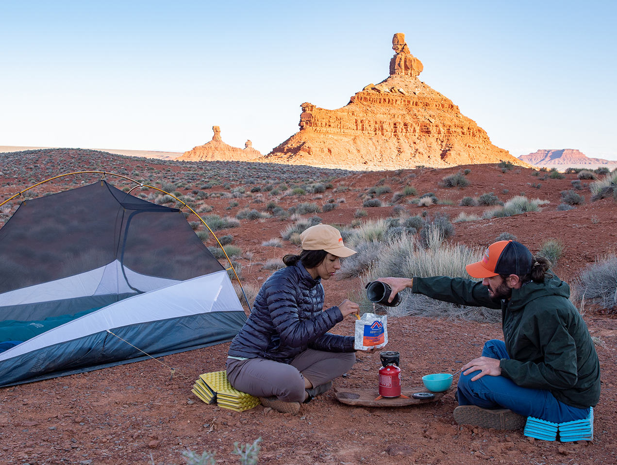 Making dinner at camp while backpacking in the Utah desert