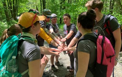 Group of hikers huddled together. 