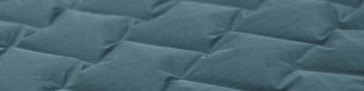 Close up macro shot of the Super/DS™ Stretchdown Hooded Jacket, zoomed in on the woven-stretch construction 