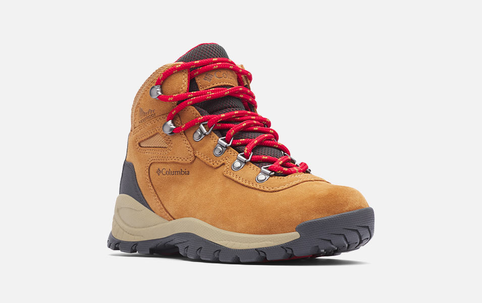 A product shot of Columbia Sportswear’s Newton Ridge Plus II hiking boots set against a white background. 
