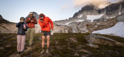 The backpacking crew gathers at dusk, taking photos of the beautiful view.