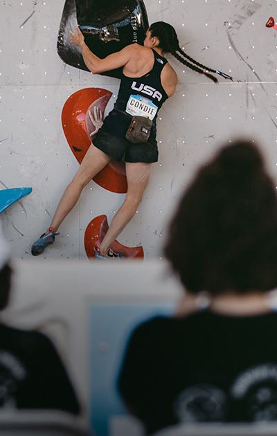Kyra bouldering in sport climbing comepition