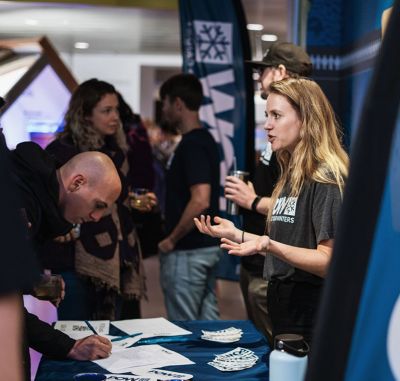 At the POW booth a person learns more about the organization