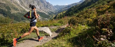 Person running on a valley trail.