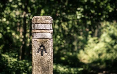 A stone and metal signpost marks the Appalachian Trail.