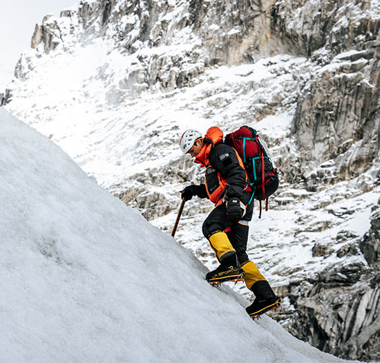 Garrett Madison exploring glaciers near Everest Base Camp in the Men's Absolute Zero™ Suit.